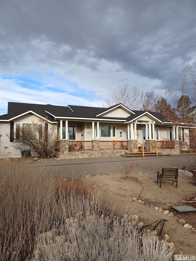 ranch-style home with a porch