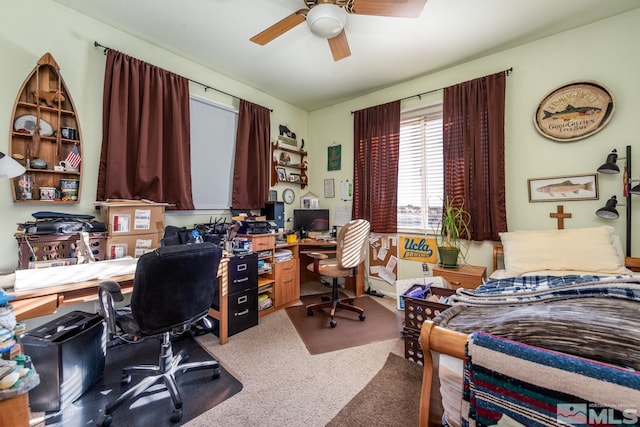 office area with carpet floors and ceiling fan