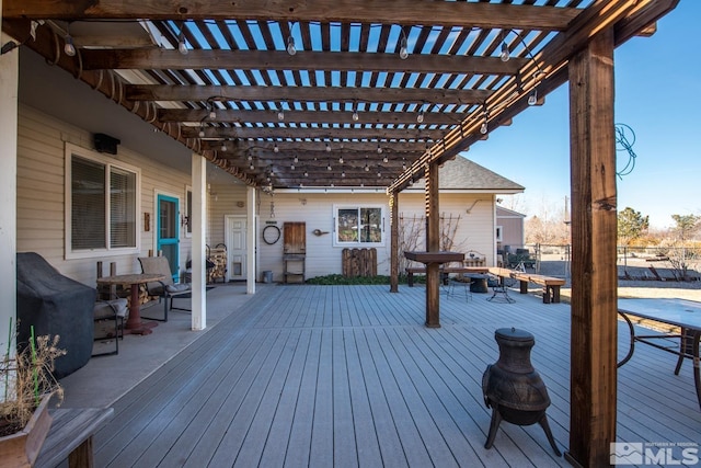 wooden terrace with a pergola