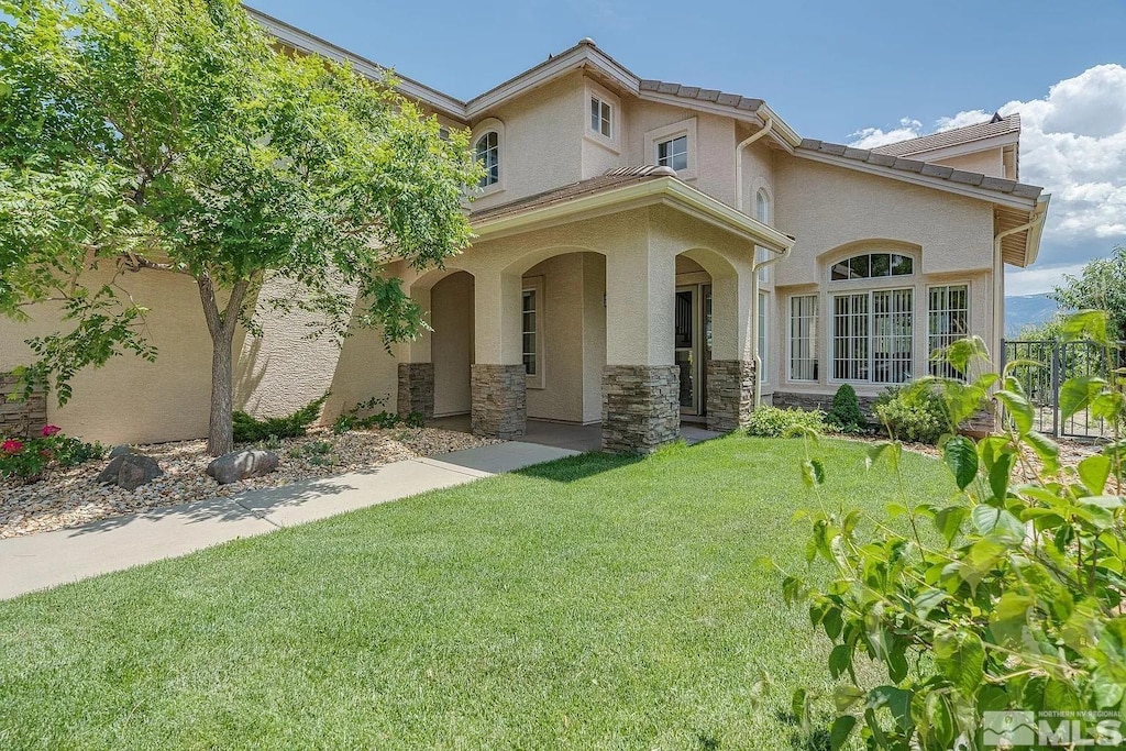 view of front of home with a front yard