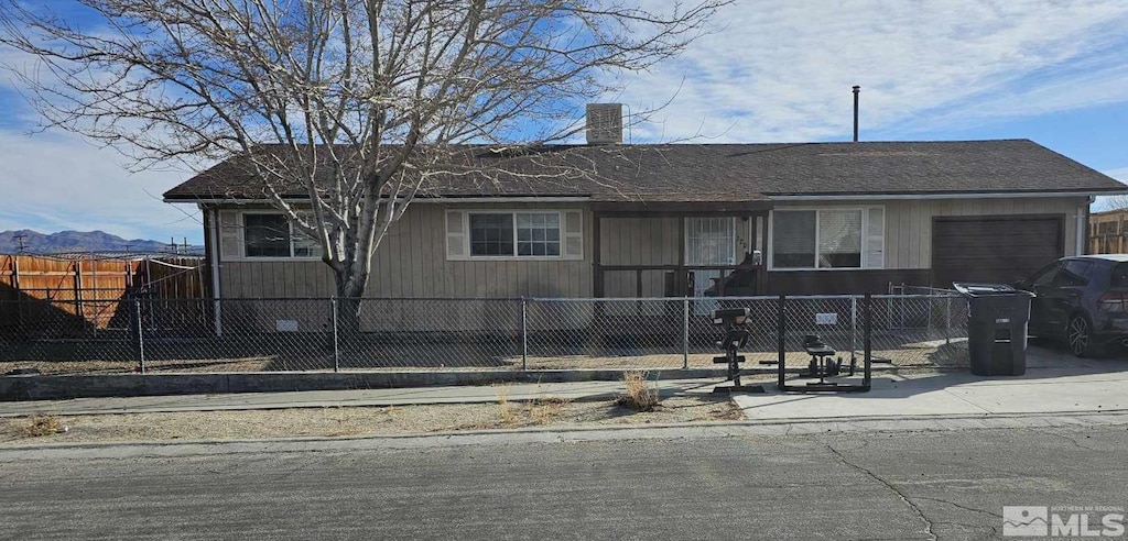 ranch-style home featuring a garage