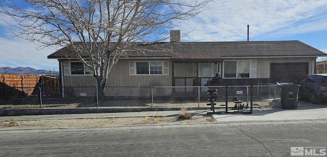 ranch-style home featuring a garage