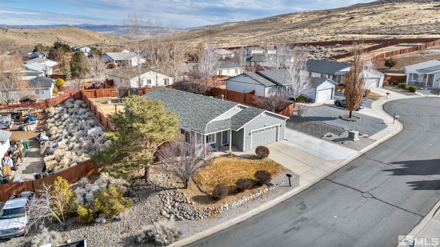 birds eye view of property with a mountain view