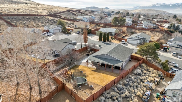 birds eye view of property with a mountain view