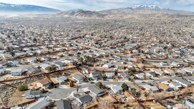 birds eye view of property featuring a mountain view