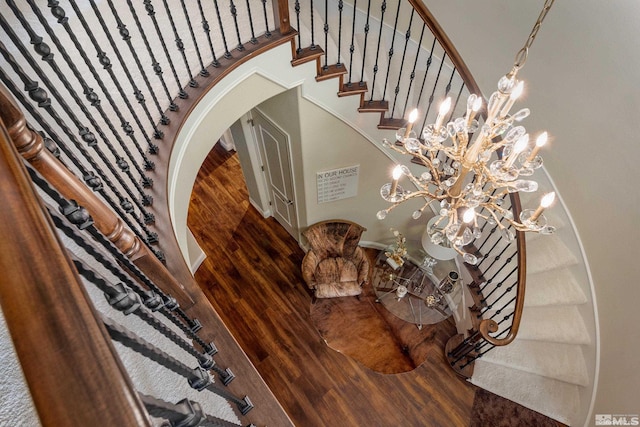 stairs featuring wood-type flooring