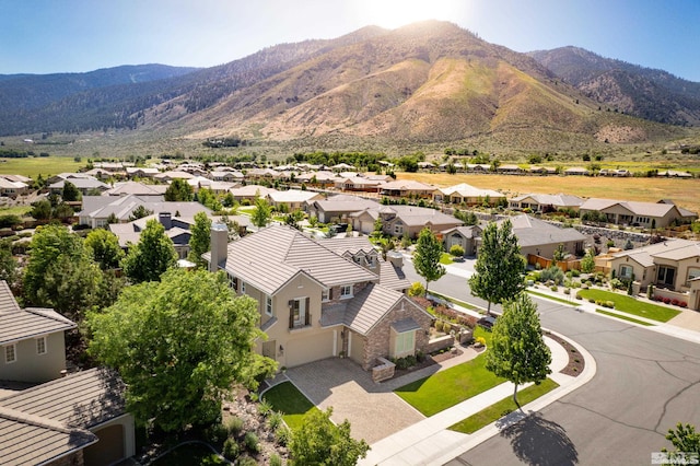 birds eye view of property with a mountain view