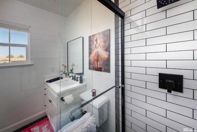 bathroom featuring vanity and a tile shower