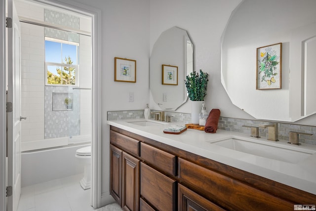 full bathroom with shower / bath combination, vanity, tasteful backsplash, and toilet