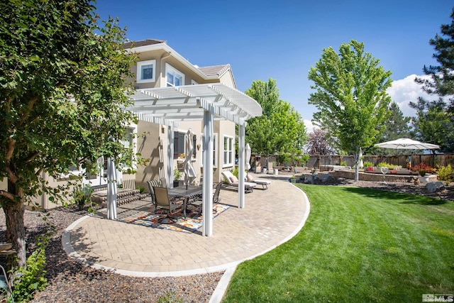 view of yard with a pergola and a patio area