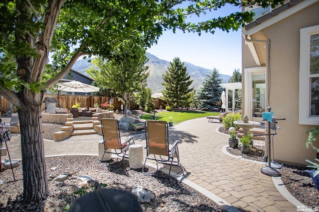 view of patio / terrace with a mountain view