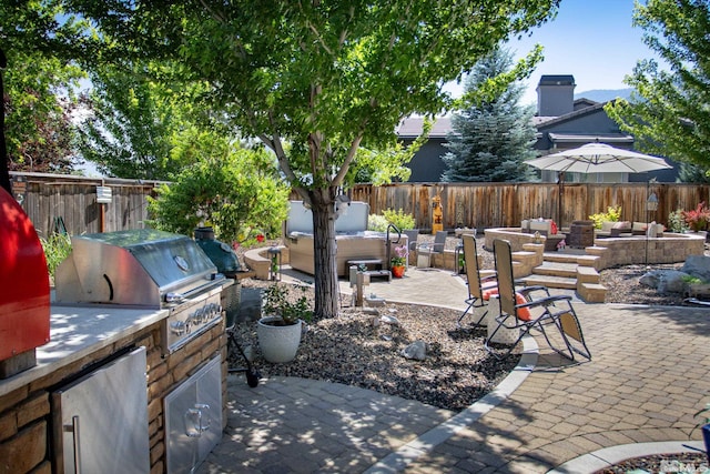 view of patio with outdoor lounge area, area for grilling, and grilling area