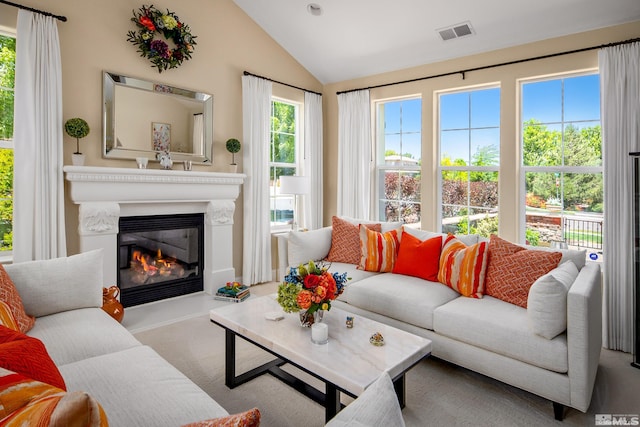 carpeted living room featuring vaulted ceiling