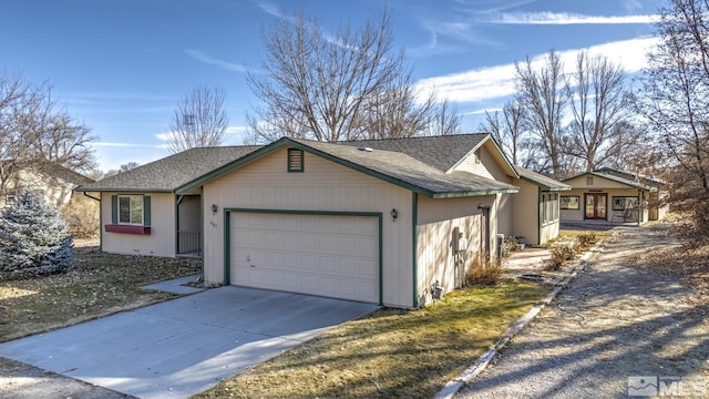 ranch-style house featuring a garage