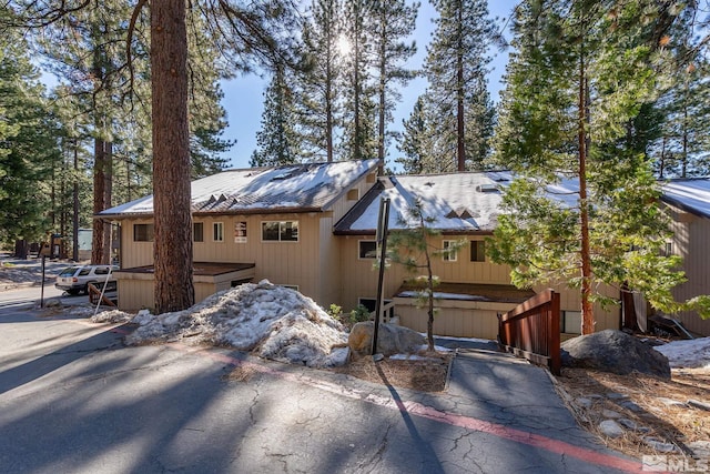 view of property exterior with a jacuzzi