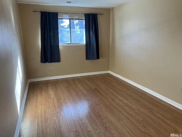 empty room featuring hardwood / wood-style floors