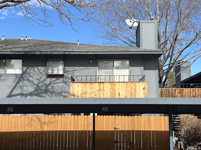 back of house with a balcony