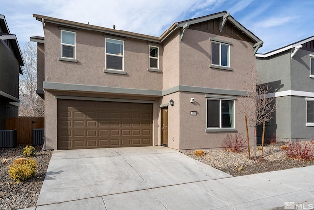 view of property featuring central AC and a garage