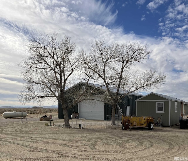 view of front of property featuring an outbuilding