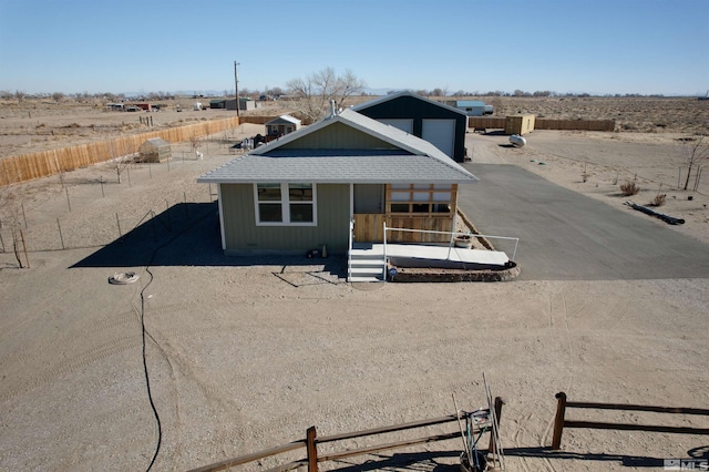 view of front facade with a rural view and covered porch