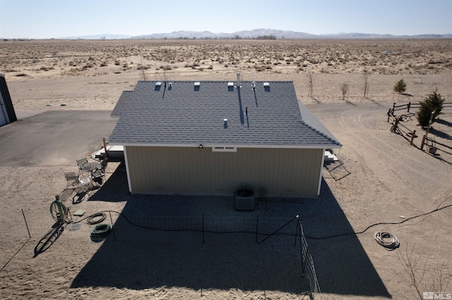 birds eye view of property featuring a mountain view