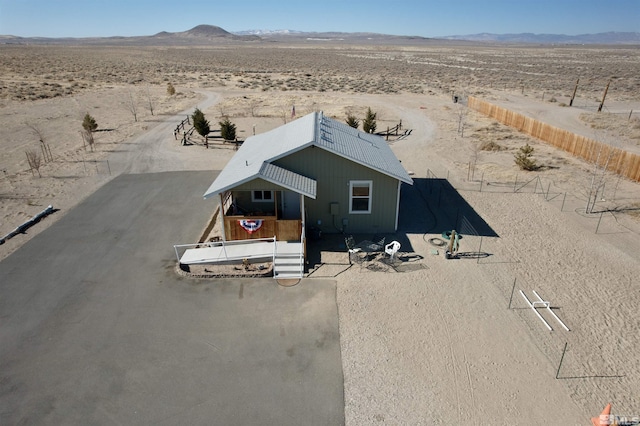 birds eye view of property with a mountain view