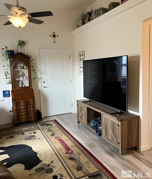 unfurnished living room featuring ceiling fan