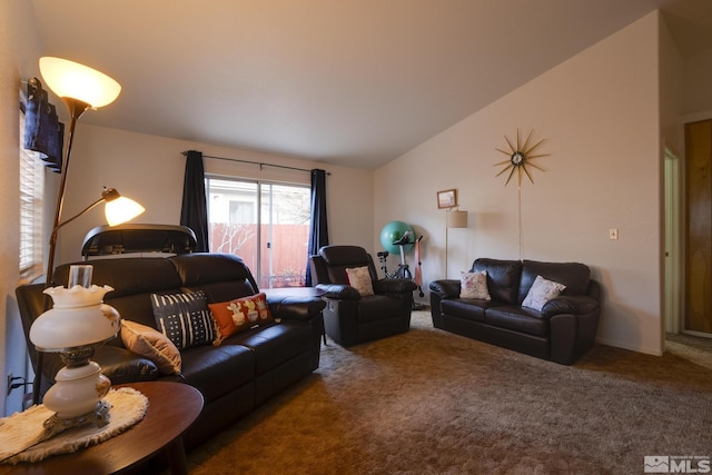 living room featuring lofted ceiling and carpet floors