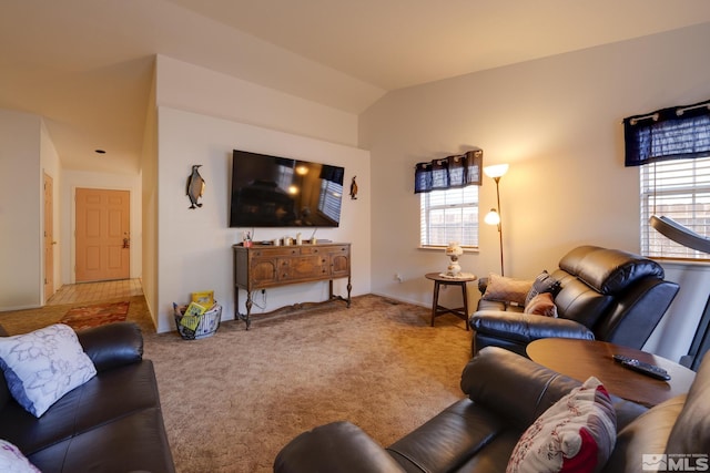 living room with lofted ceiling and carpet flooring