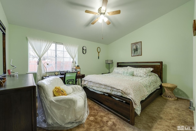 carpeted bedroom featuring lofted ceiling and ceiling fan