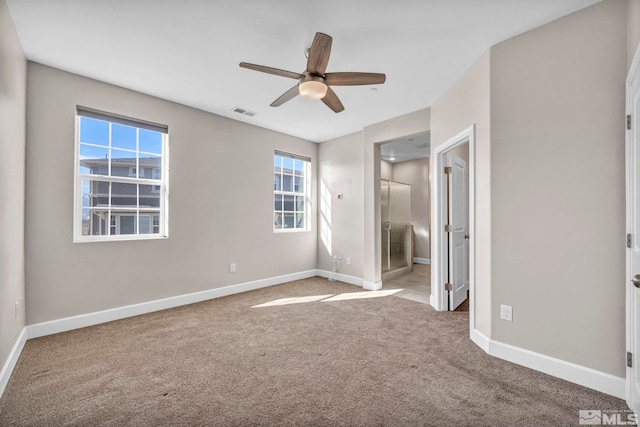 unfurnished bedroom featuring ceiling fan, connected bathroom, and carpet floors