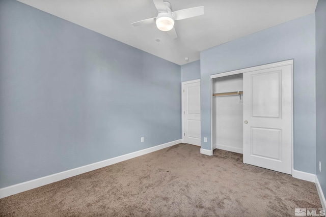 unfurnished bedroom with carpet, ceiling fan, and a closet