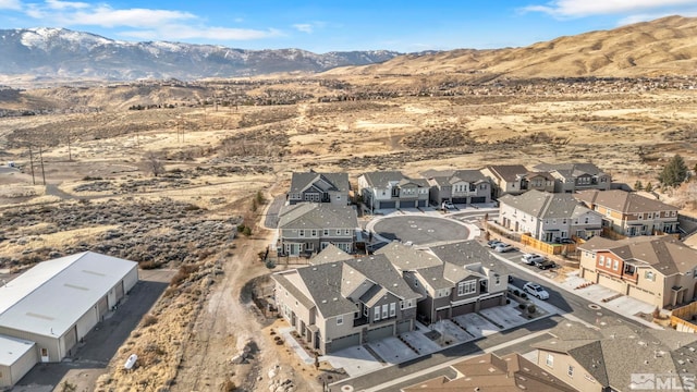 birds eye view of property with a mountain view