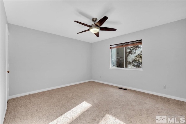 carpeted empty room with ceiling fan