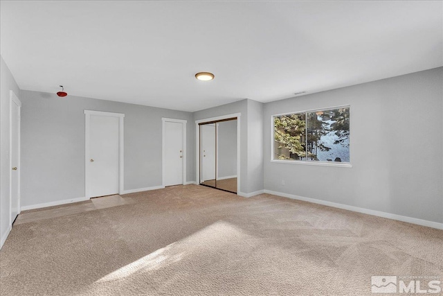 unfurnished bedroom featuring carpet floors