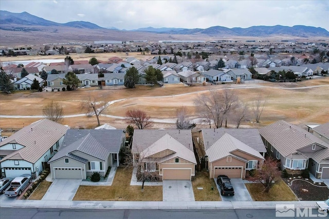 drone / aerial view featuring a mountain view