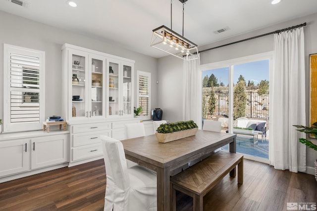 dining area featuring dark hardwood / wood-style floors