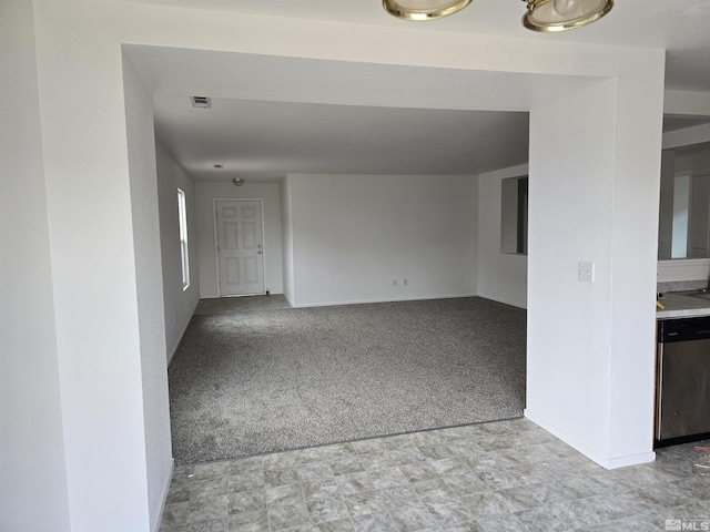 unfurnished living room featuring light colored carpet