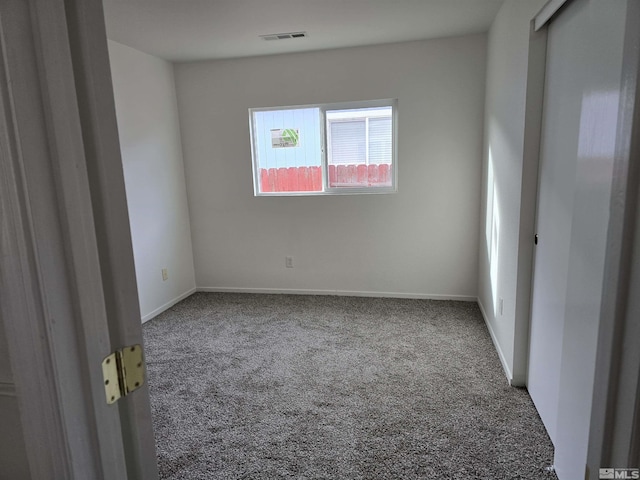 empty room featuring carpet floors