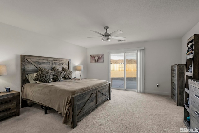 bedroom featuring ceiling fan, light carpet, and access to outside