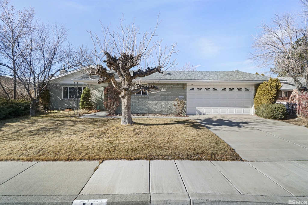 ranch-style house featuring a garage