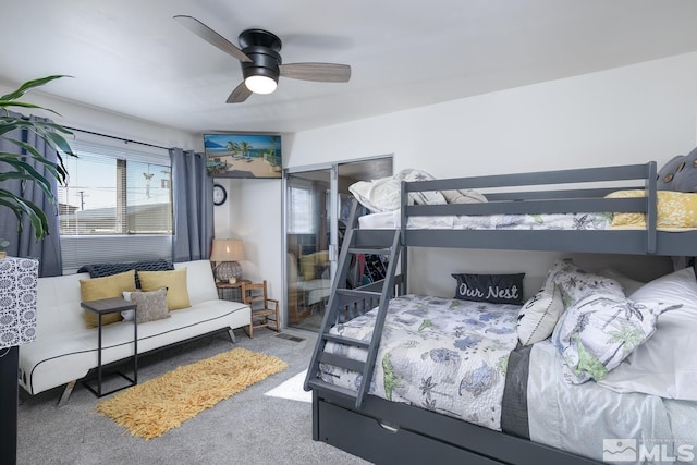 bedroom with ceiling fan and carpet