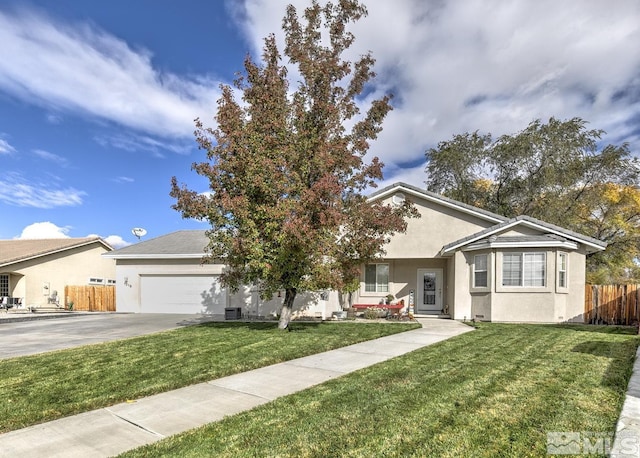 ranch-style home with a garage and a front lawn