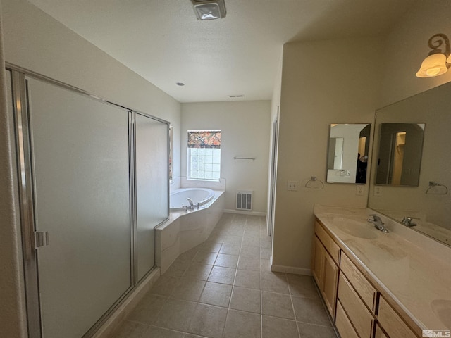 bathroom featuring vanity, tile patterned floors, and plus walk in shower