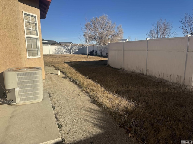 view of yard featuring central AC