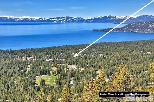 bird's eye view with a water and mountain view