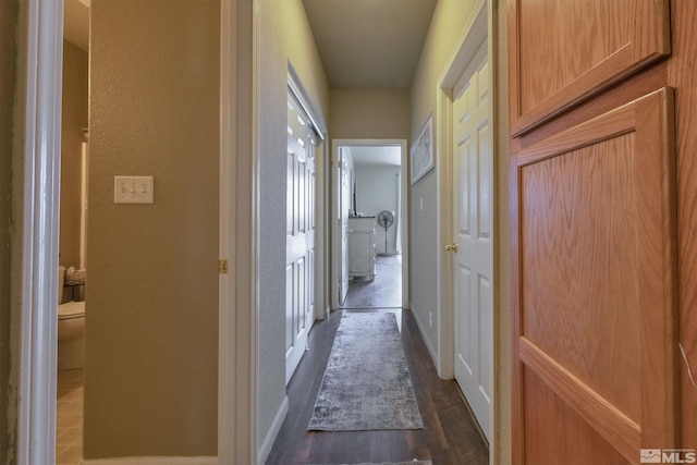 corridor featuring dark hardwood / wood-style floors