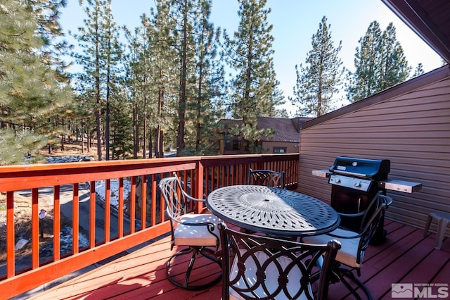 wooden deck with grilling area