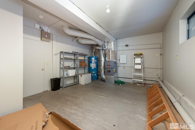 basement with strapped water heater and heating unit