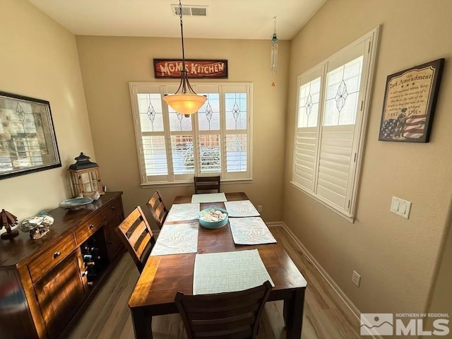 dining area featuring dark hardwood / wood-style flooring